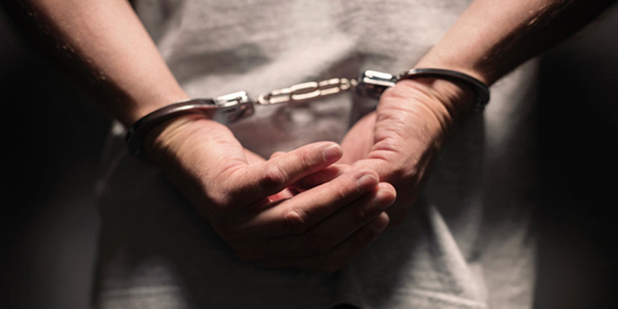 Hands in handcuffs