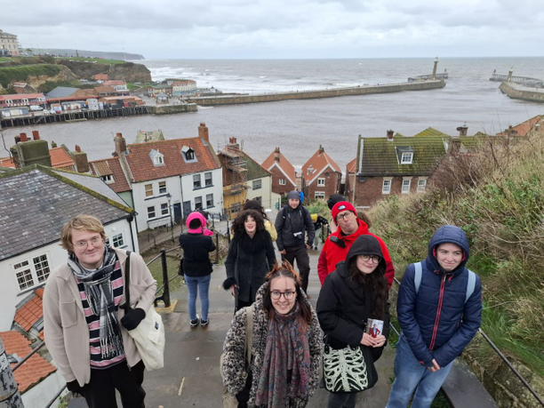 Group of people standing on steps