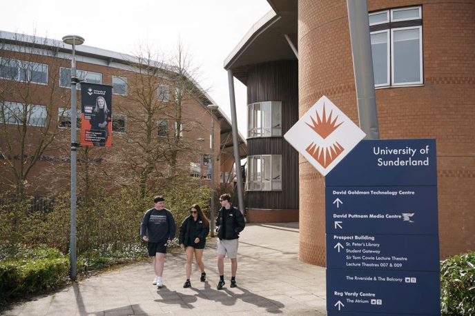 Three students outside the University