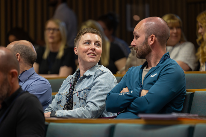 Attendees talking whilst at the conference