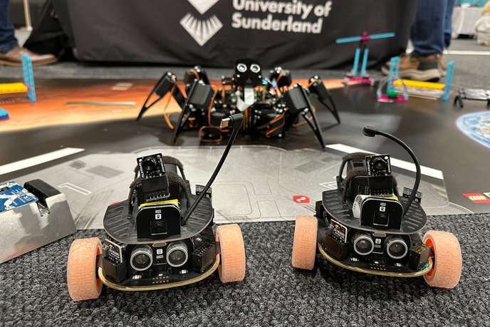 Three robots stationary at event