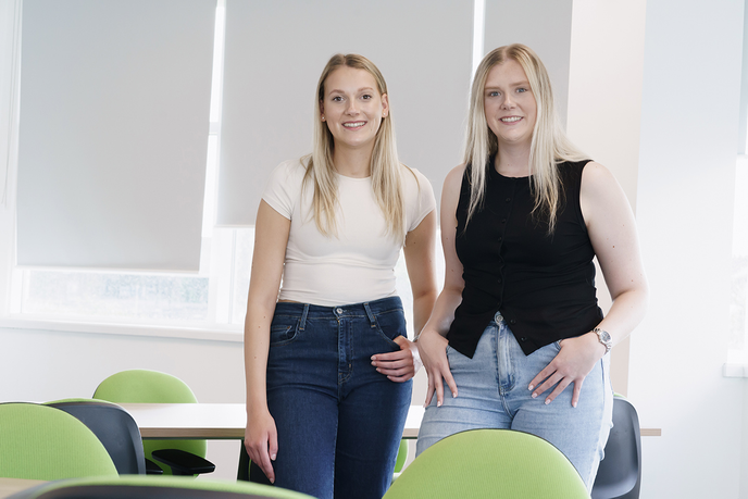 Two women standing