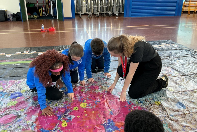 University Staff leading activity with school students