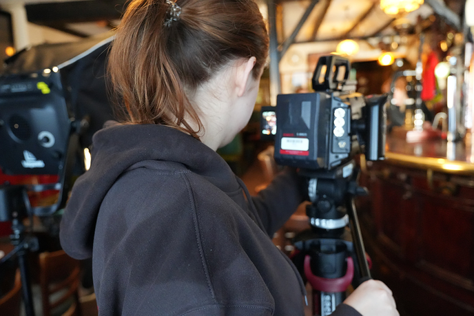 Student filming on camera