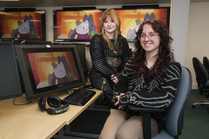 Two students sitting at computers