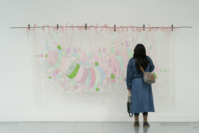 Woman looking at artwork