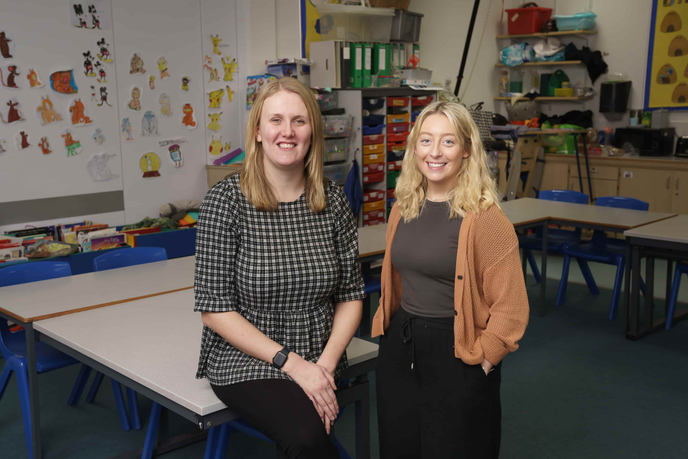 Two women in a classroom