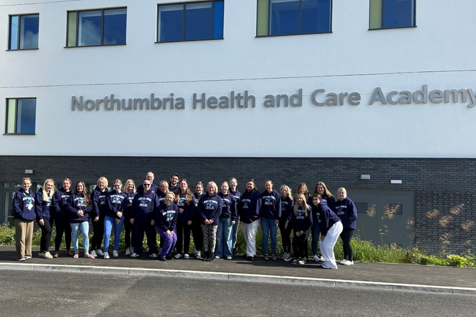 Students standing outside the Health and Care Academy