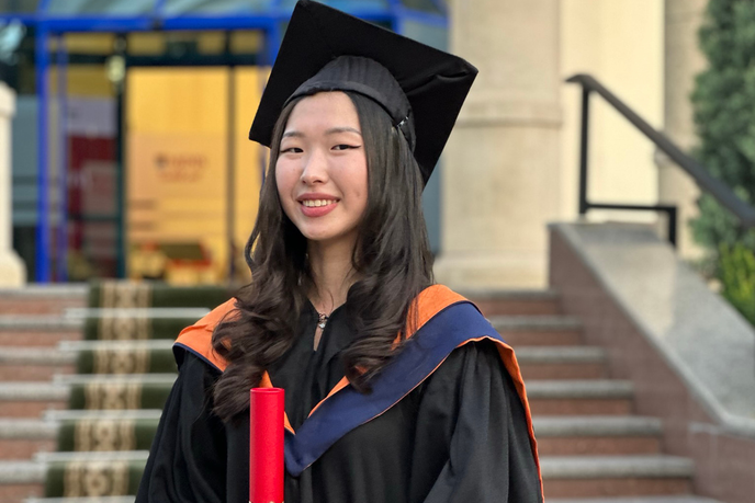 Graduate in cap and gown
