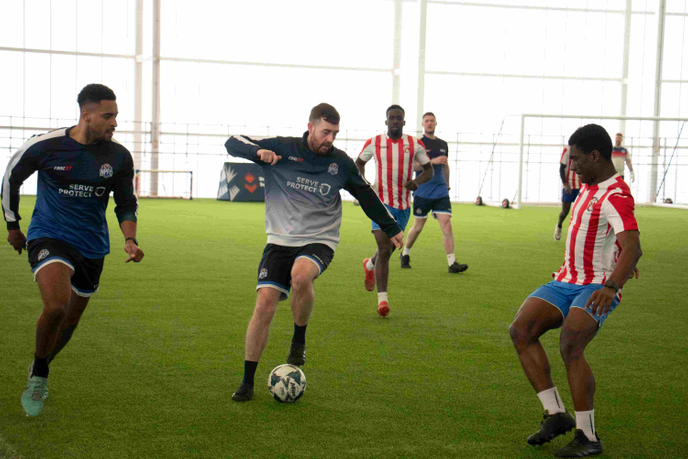 Football player kicking a ball