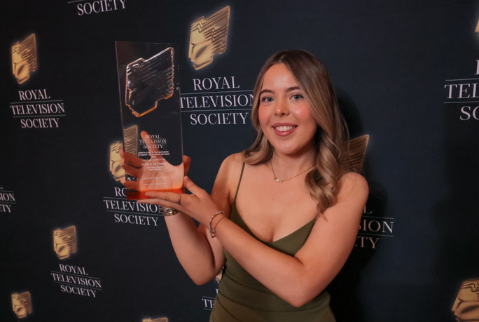 Woman holding an award