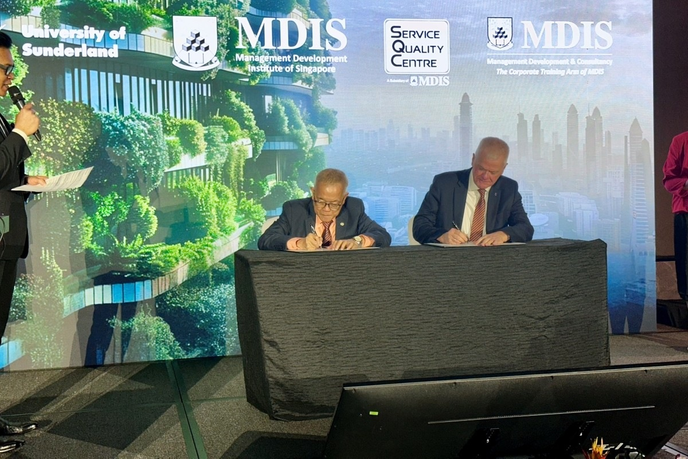 University and Institute officials signing document