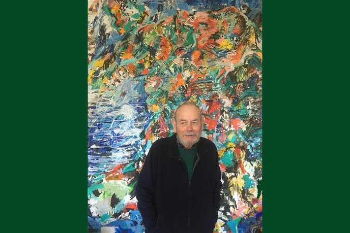 Man standing infront of artwork