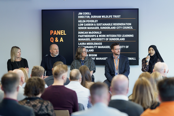 Academics and guests speaking on a panel