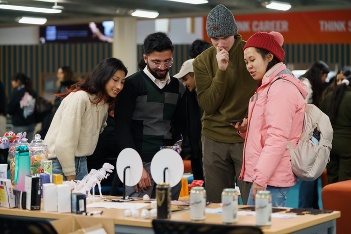 Students stood around a table