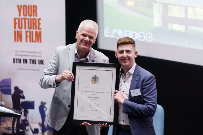 Vice-Chancellor with student holding certificate