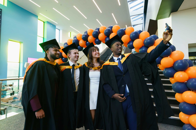 Graduates posing for a photo