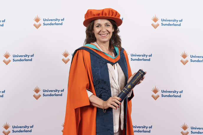 Honorary graduate in cap and gown