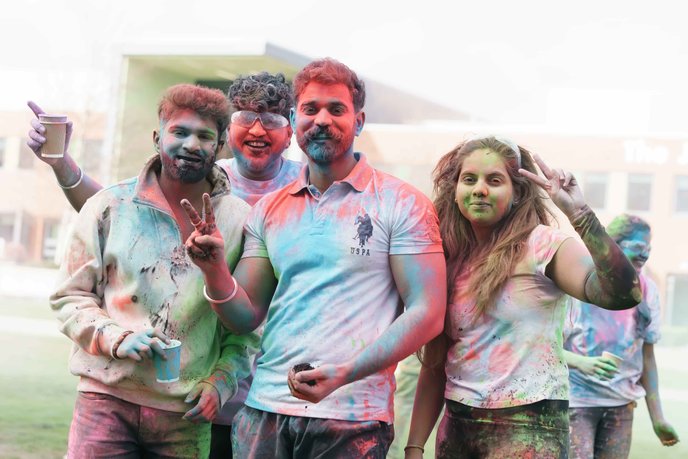 Four students standing