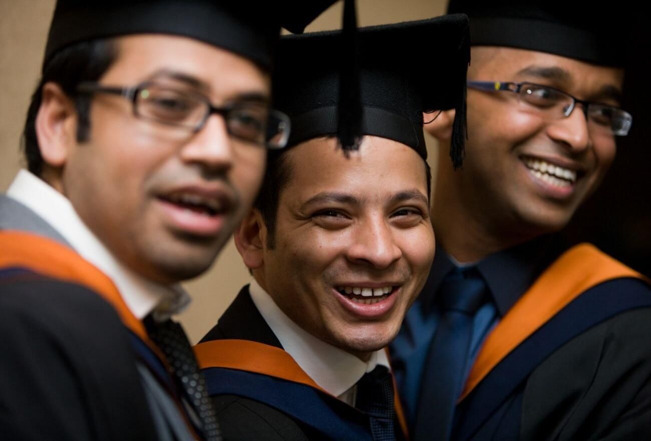 Three students at their graduations
