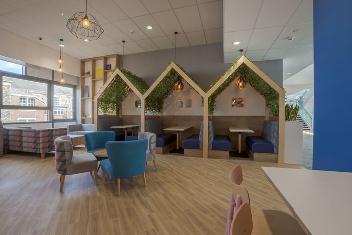 Tables and chairs in a cafe in the Gateway building