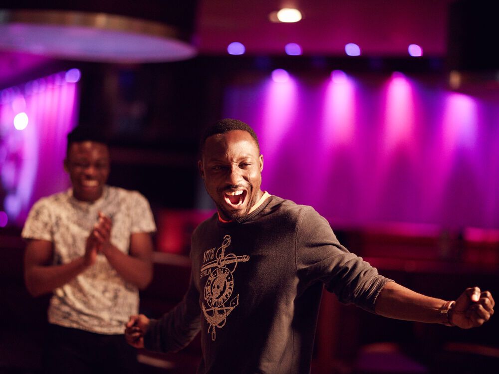 Two students looking very joyful on a night out