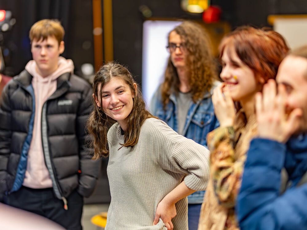 A group of applicants taking part in a workshop, laughing together