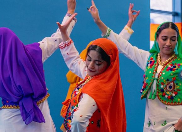 People dancing in traditional Indian clothing