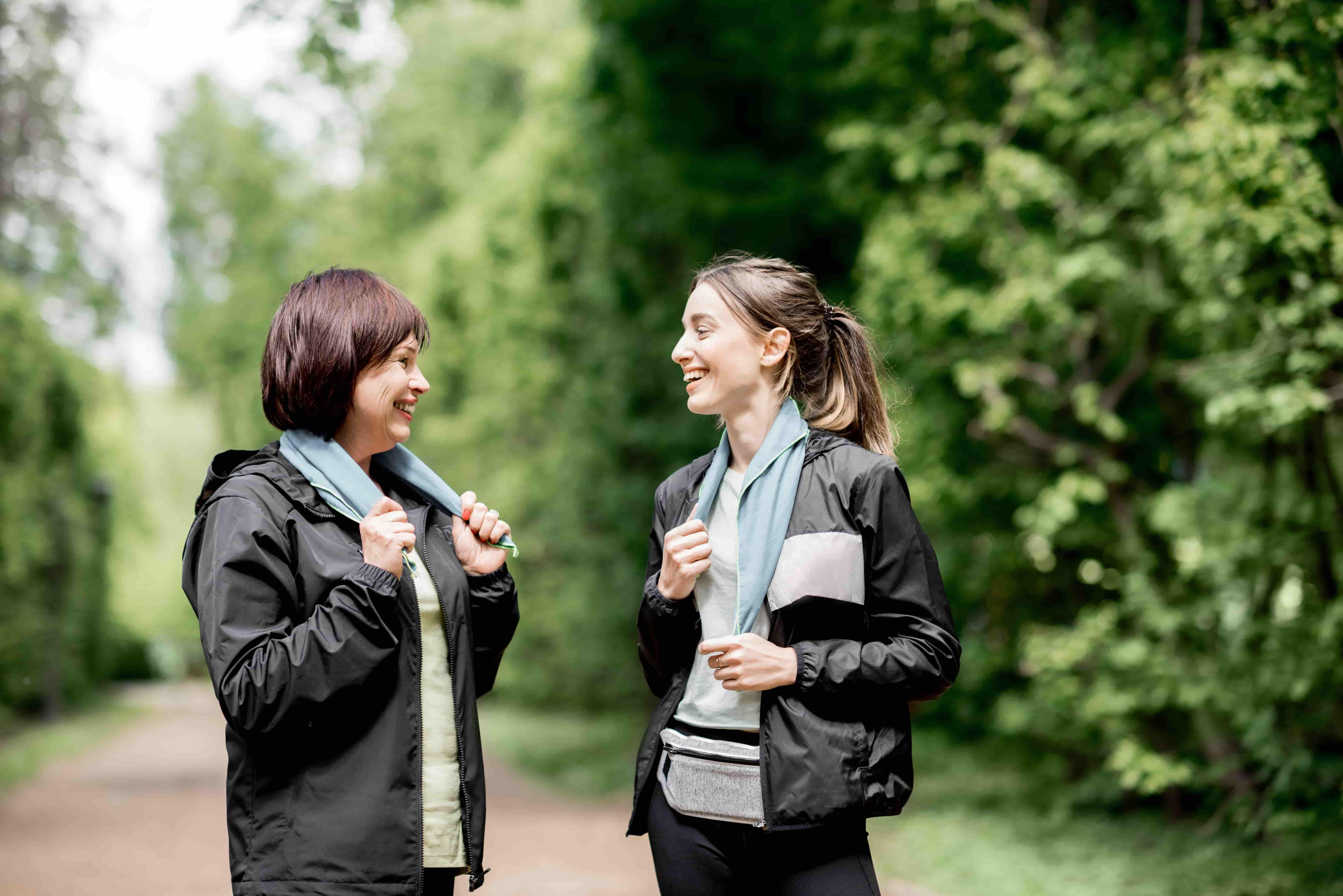 Two people talking while they walk