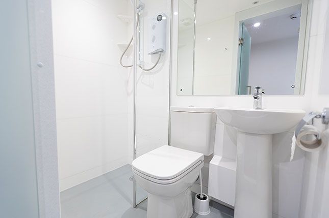 A toilet, sink, and shower in a Panns Bank Refurbished Ensuite Bathroom