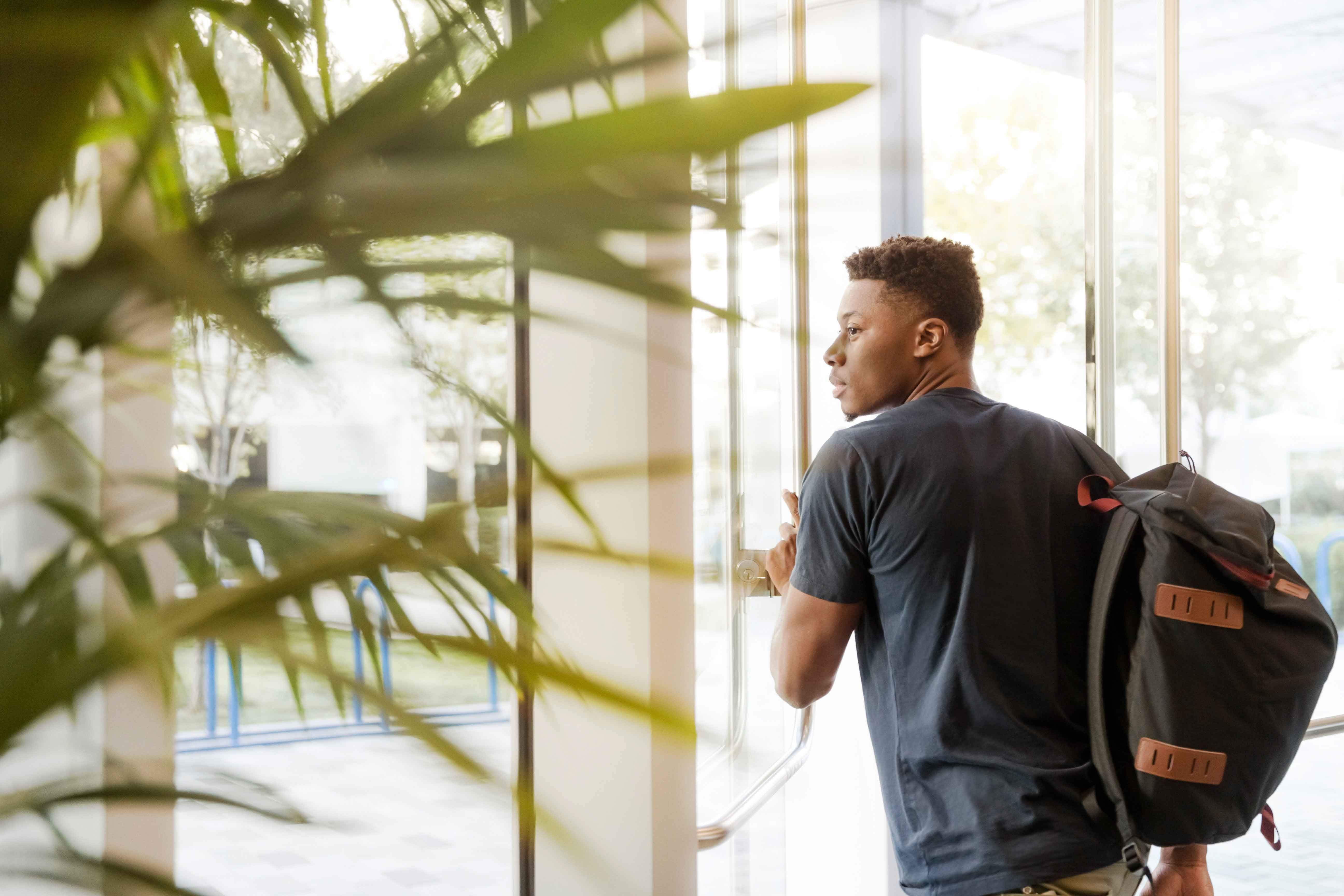 student carrying backpack