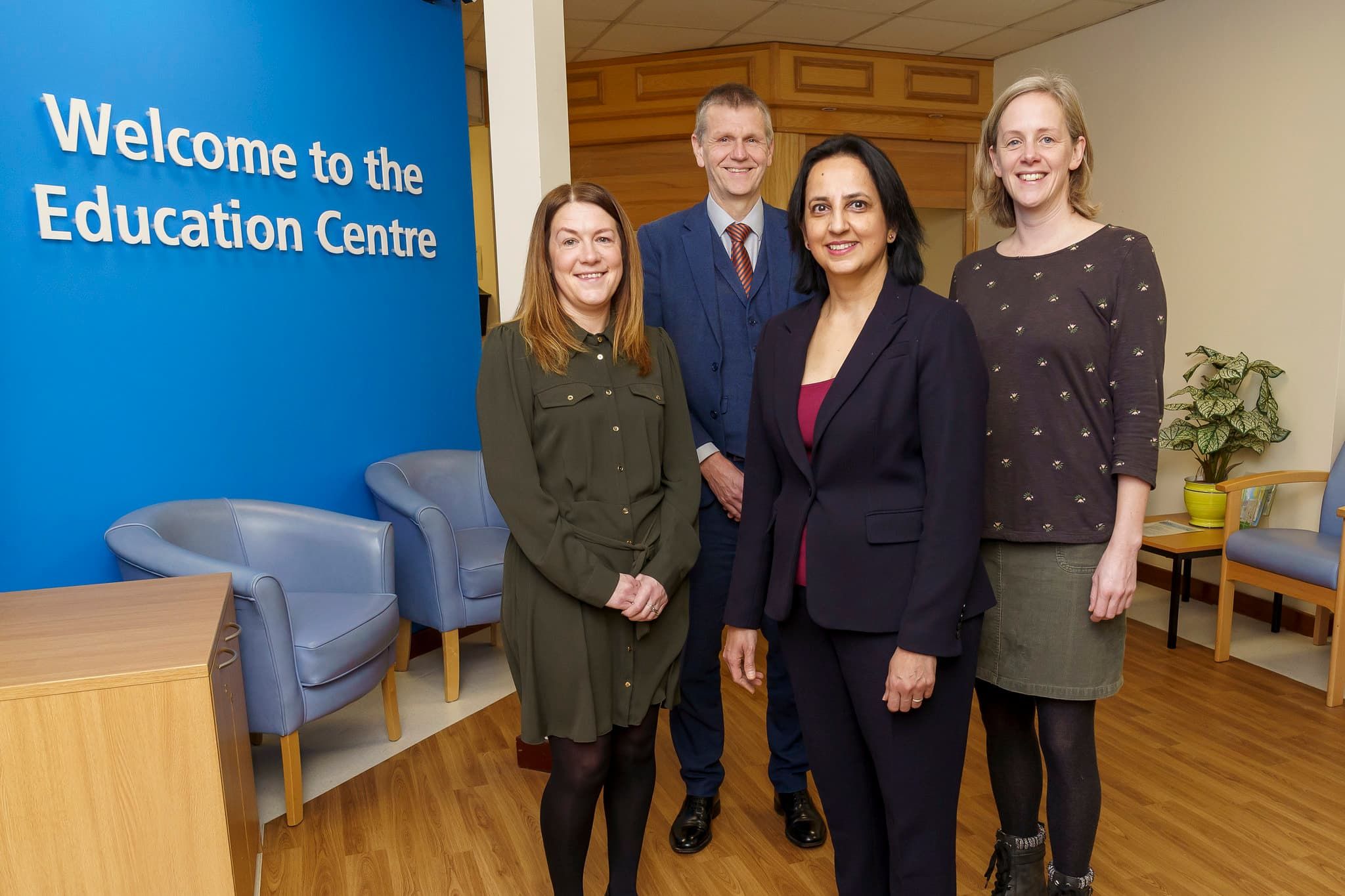 Professor Scott Wilkes, Claire Livingstone, Deepali Varma, and Dr Ellen Tullo at the Education Centre at North Tyneside General Hospital, North Shields, smiling towards the camera