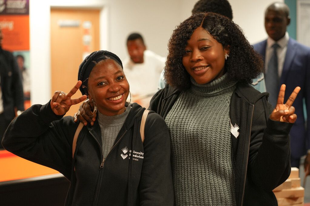 Students posing and smiling at the camera