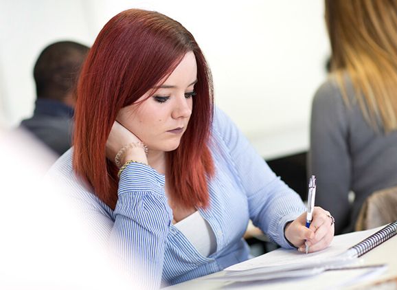 A student taking notes