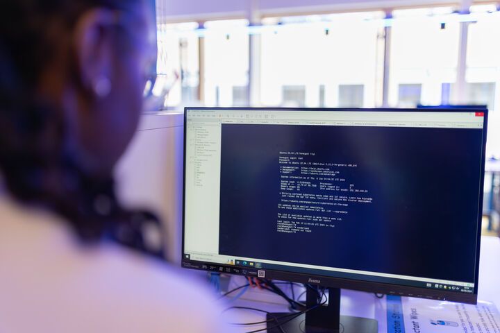 A computer science student working at a computer