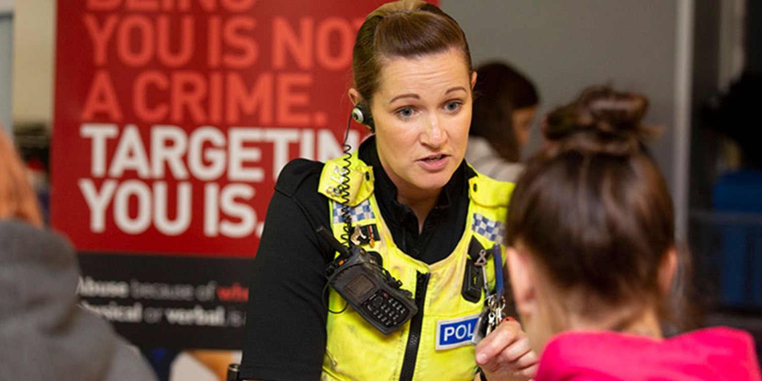 A police officer chatting to a student at an Open Day