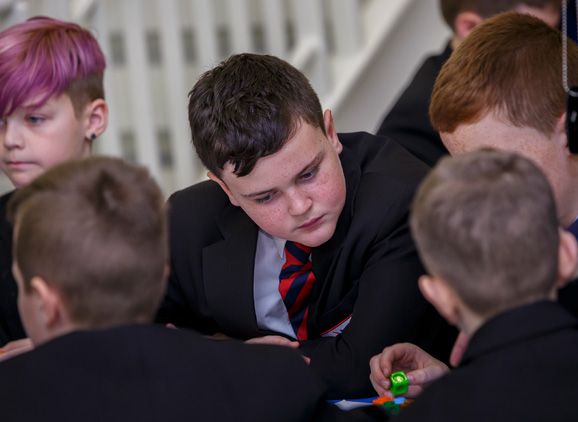 Secondary school pupils taking part in a task
