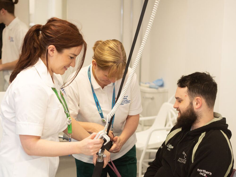 Two Occupational Therapy students working with a PCPI