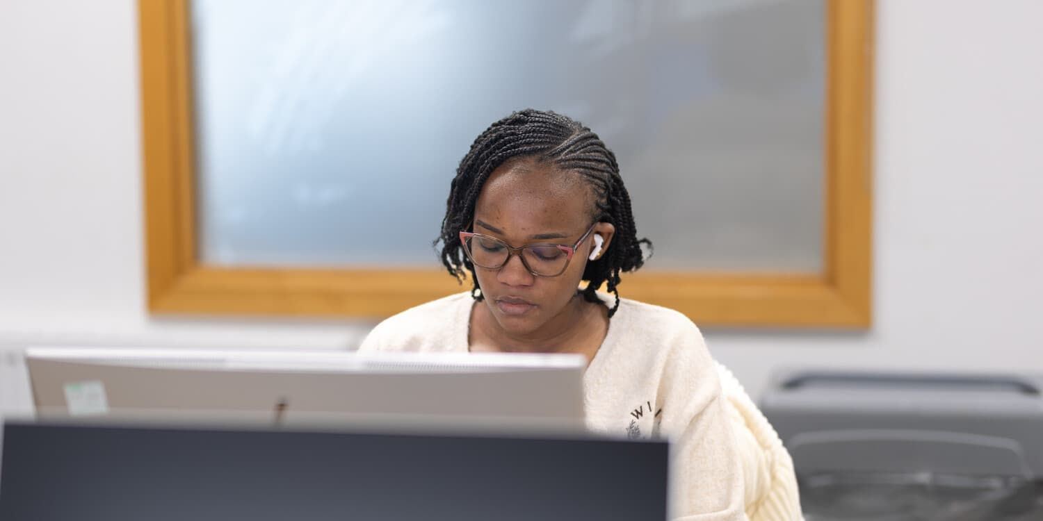 A student working on her laptop