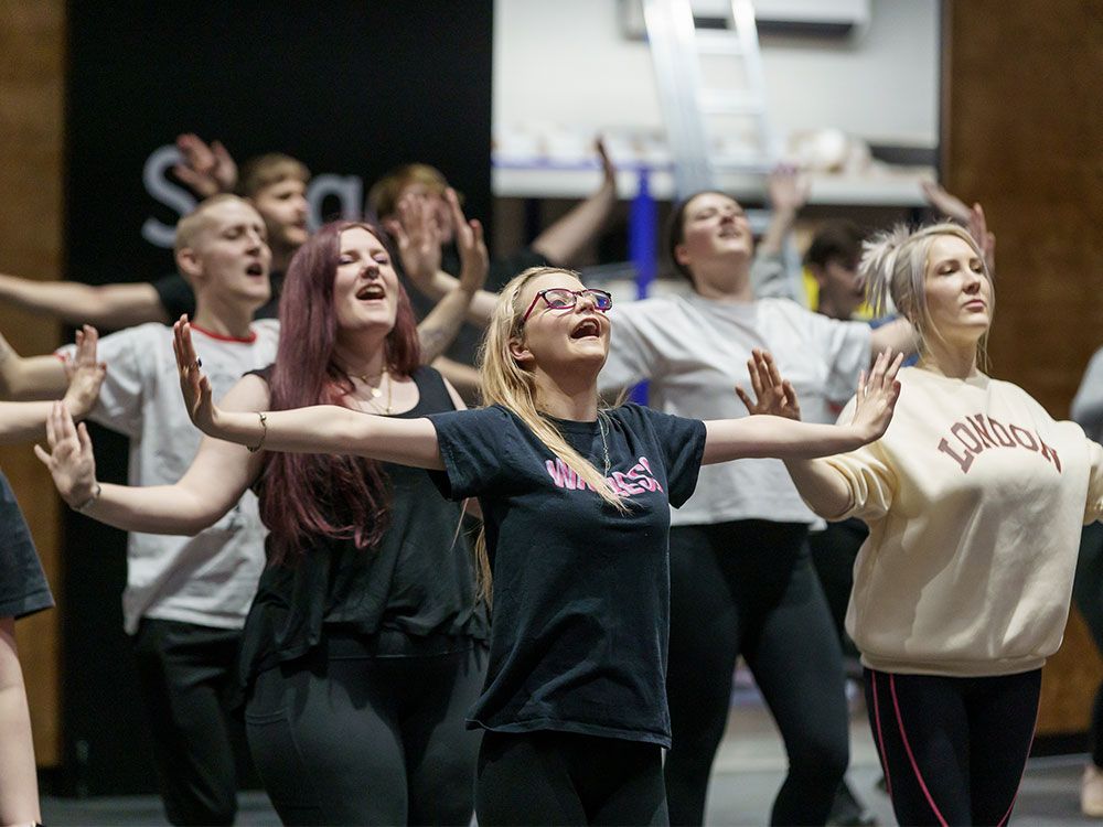 A group of students rehearsing a performance of Sister Act in the Fire Station Auditorium