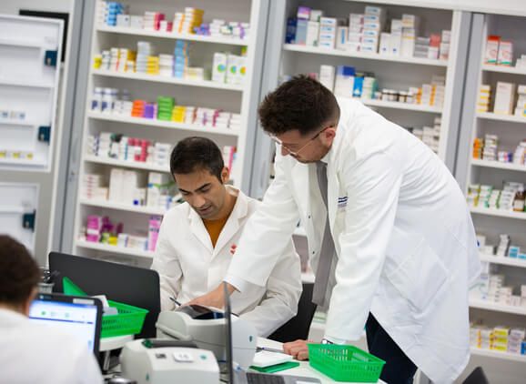 Two pharmacy students working in the pharmacy dispensary