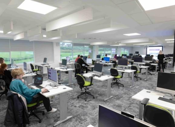 a wide shot of psychology students in the murray health ICT skills lab using the computers