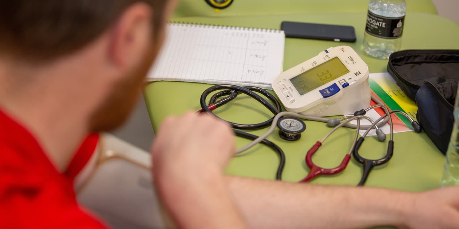 students using blood pressure machines and stethoscopes