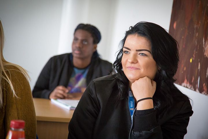 A student listening in the classroom