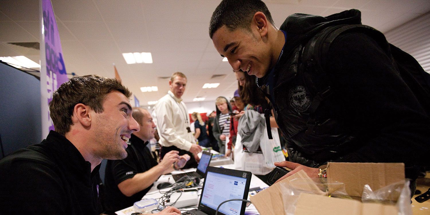Police officer talking to student at university event